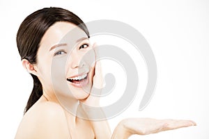 Woman showing beauty product on her handÂ 